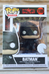 Batman Funko Pop! vinyl figure in packaging on a wooden surface