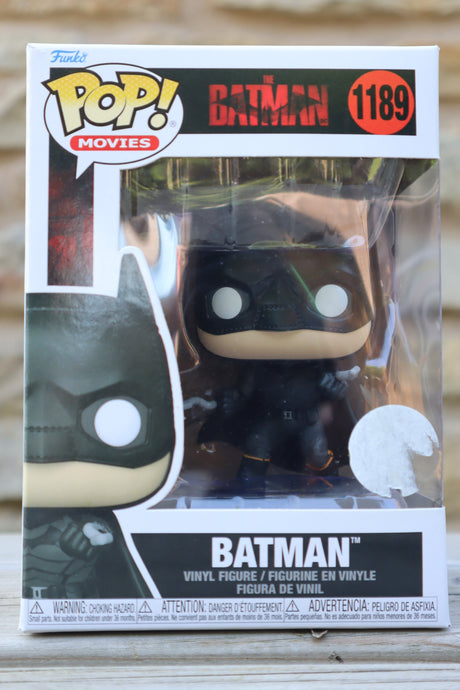 Batman Funko Pop! vinyl figure in packaging on a wooden surface