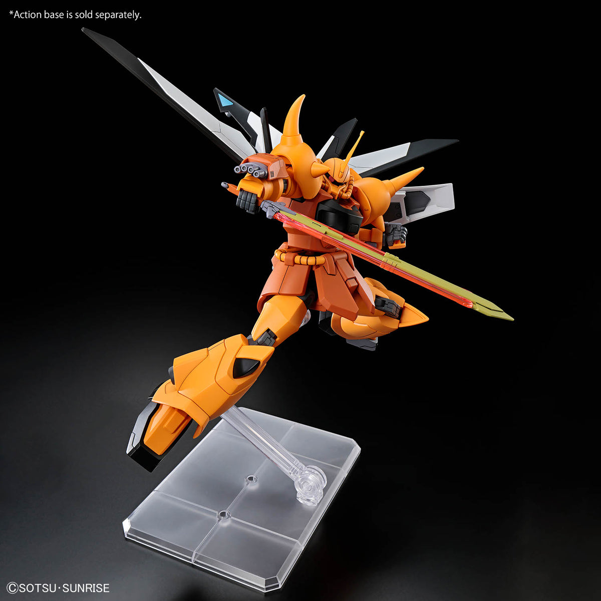 An orange and black Gundam-style mecha figurine posed mid-action on a clear plastic display stand against a black background. The figure holds a long sword with a green and red blade, and small Japanese text appears in the top left corner.