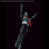 A collectible action figure of Kamen Rider in a dynamic jumping pose against a solid black background. The figure features a dark green and black bodysuit with a bright red cape and silver belt details.