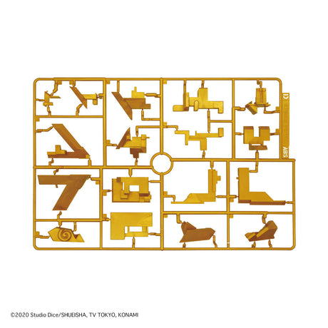 Gold toy assembly sheet with various parts on a white background