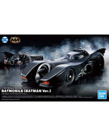 Front packaging artwork for a 1/25 scale model kit of the Batman Batmobile, featuring a dark black and gray futuristic car on a smoky black background, with DC and Bandai logos visible.