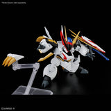 Model kit of a robot with gold, red, and black accents on a black background