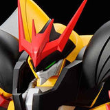 Close-up of a mecha robot head and upper chest, featuring a bold yellow and red color scheme with black armor plating and a small green eye detail, set against a dark background.