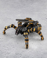 A black and gold robotic spider toy with a mounted gun barrel, posed on a textured gray surface.