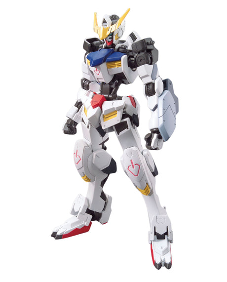 A white Gundam-style mecha action figure with black, blue, yellow, and red details, posed against a plain white background.