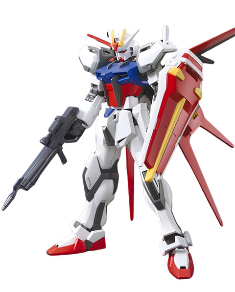 A white, red, and blue mecha robot figure holding a black rifle, with a large red and yellow shield on its back, isolated on a white background.