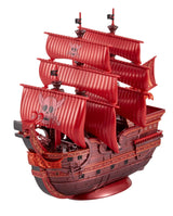 A red pirate ship model with multiple striped red sails, a skull-and-crossbones flag, and a dark reddish-brown hull, displayed on a plain white background.