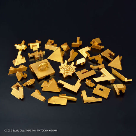 Gold geometric puzzle pieces on a black background