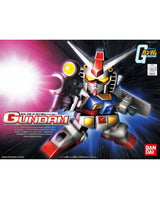 Bandai Gundam model kit box art featuring a small white, red, and blue mecha robot with a yellow eye and weapon, set against a dark blue starburst background with the large word GUNDAM and Bandai logo.