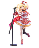 A collectible anime figurine of a blonde female singer character in a red and white costume, posed next to a black microphone stand on a plain white background.