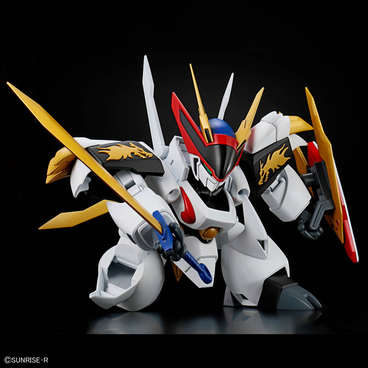 Model kit of a robot with gold and red accents on a black background