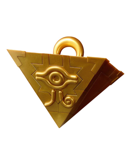 A golden triangular pendant or charm with a top loop, featuring a raised eye-like emblem and geometric details, shown on a plain white background.