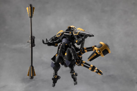 Black and gold robot figure with a weapon on a gray background